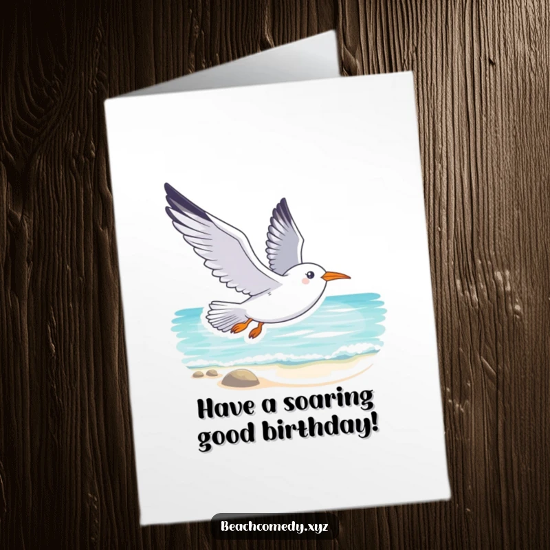 Smiling Free Printable Birthday Card: A seagull soars gracefully above a tranquil beach, conveying peaceful birthday wishes.